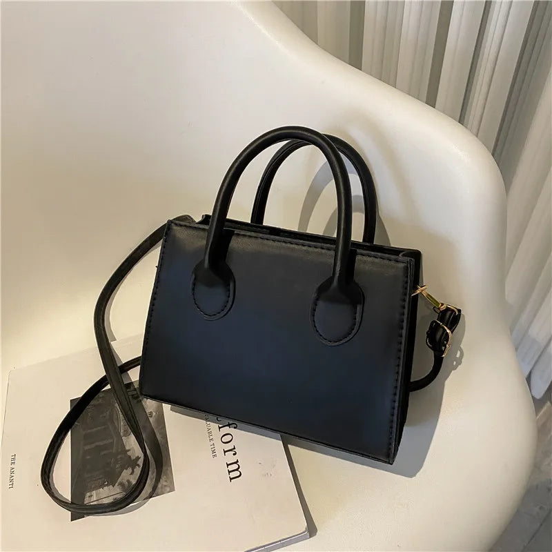 Elegant Black Handbag with Dual Handles